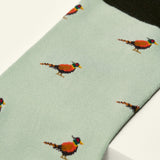 Light green sock with pheasant pattern on a white background
