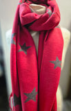 Red scarf with star patterns on a mannequin